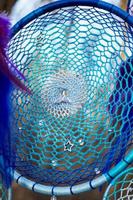 Handmade dream catcher with feathers threads and beads rope hanging photo