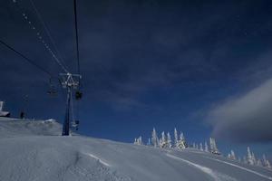 sunny winter morning in the mountains of sheregesh on the ski track photo