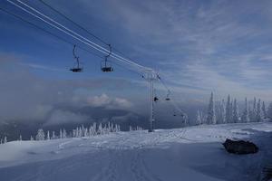 sunny winter morning in the mountains of sheregesh on the ski track photo