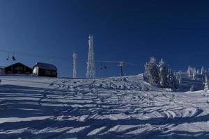 sunny winter morning in the mountains of sheregesh on the ski track photo