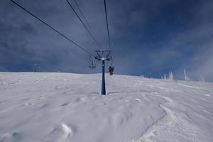 sunny winter morning in the mountains of sheregesh on the ski track photo