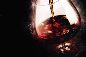 whiskey glass on black background - food and drink alcoholic beverage photo