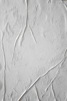 Blank white glued paper for poster texture overlay. Crumpled and wrinkled pattern for background. Matted wet paper for mockup posters, flyer,  brochure, and banner design photo