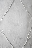 Blank white glued paper for poster texture overlay. Crumpled and wrinkled pattern for background. Matted wet paper for mockup posters, flyer,  brochure, and banner design photo