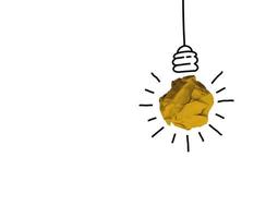 Good idea sign concept with paper light bulb isolated in white background. Crumpled paper ball with hand drawing. photo