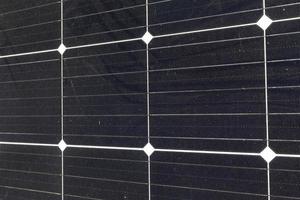 black solar panels illuminated by sunlight photo