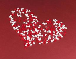 red and white sweet heart shaped candies photo