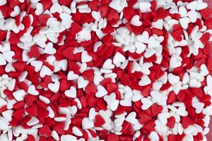 red and white sweet heart shaped candies photo