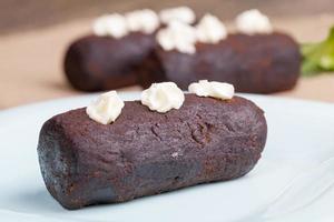 cake is covered with a layer of powdered sugar with cocoa photo