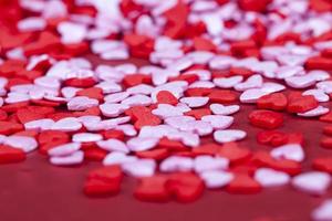 red and white sweet heart shaped candies photo