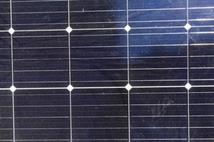 black solar panels illuminated by sunlight photo