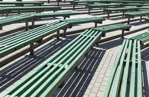 old wooden benches of green color photo