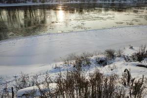 frozen lake in winter cold weather photo