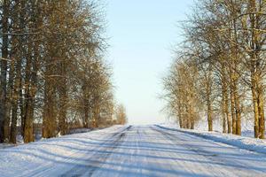 Ruts on a snow covered road photo