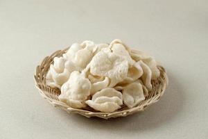 Krupuk Upil or Krupuk Mlarat, Indonesian Popular Cracker made from Cassava Flour and Fried without Oil. photo