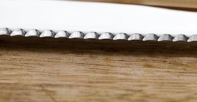 sharp studded knife blade for cutting photo