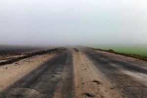 dirty road, fog photo