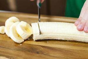 making smoothies with yellow banana photo