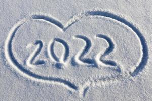 a heart symbol drawn on snow photo