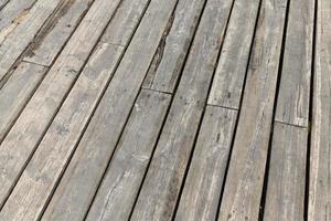 a wooden pier by the lake photo