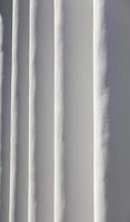 the columns of the building painted in white paint photo