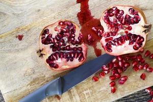 red and ripe fruit pomegranate with red grains photo