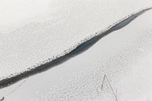 river covered with ice and snow photo