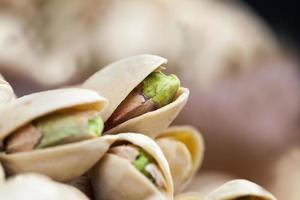 delicious natural dried and salted pistachio nuts photo