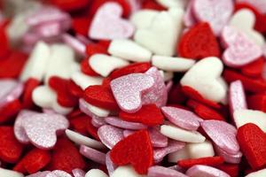 red and white sweet heart shaped candies photo