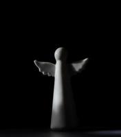 white angel figurine, religious symbols photo