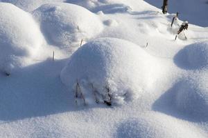 deep drifts of soft snow in the winter season photo