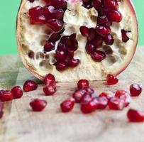 red and ripe fruit pomegranate with red grains photo