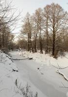 river covered with ice and snow photo