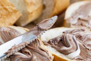 natural cocoa chocolate paste during Breakfast with baguette photo