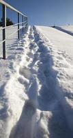 footprints on snowdrifts after walking photo