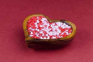 red and white sweet heart shaped candies photo