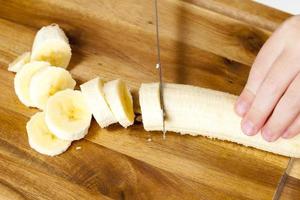 making smoothies with yellow banana photo