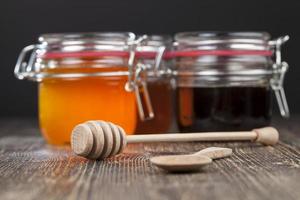 old table on which there is a healthy and sweet bee honey photo