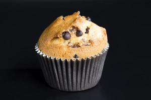 wheat cupcake with chocolate chunks, close up photo