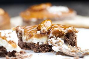 tartlet with milk cheese filling and lots of salted caramel with nuts photo