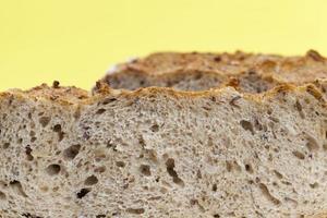 loaf of dark bread made from several types of flour photo