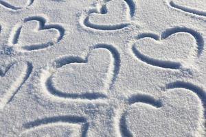 drawn in the winter season, the heart on the snow photo