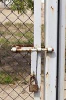 metal gates and a fence photo