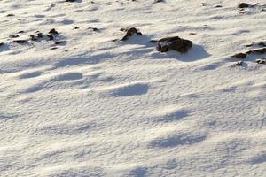 covered with snow plowed earth , photo