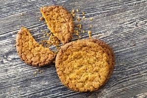 broken cookies with crumbs on the table. photo