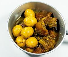 Stewed eggs and pork or eggs and pork in brown sauce in pot photo