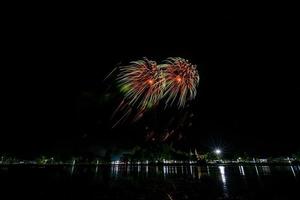 fireworks celebration in the dark background photo