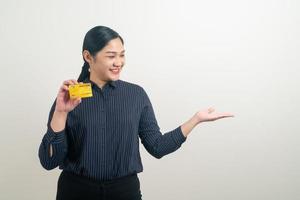 Asian woman holding credit card with white background photo