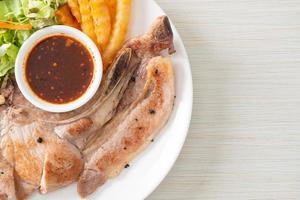 grilled pork chop steak with Thai spicy dipping sauce photo