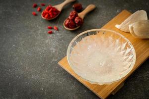 Edible bird's nest soup in glass bowl photo